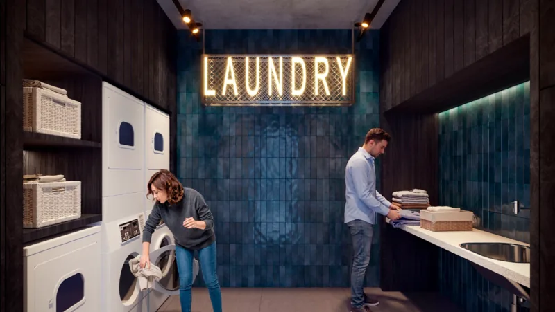 Laundry Share with washing and drying machines and a waiting area with counter