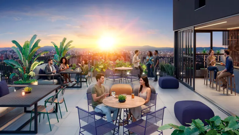 Sky Bar at the top of the building, with counter, stools and an open city view at dusk